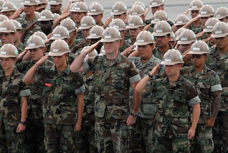 1200px-US_Navy_090911-N-3289C-180_Seabees_assigned_to_Naval_Mobile_Construction_Battalion_(NMCB)_3_salute_the_national_ensign_during_a_Sept._11_memorial_service.jpg