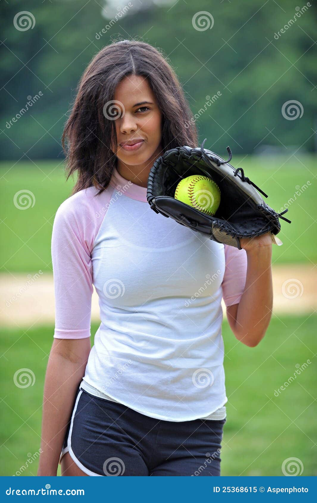 beautiful-biracial-young-female-softball-player-25368615.jpg