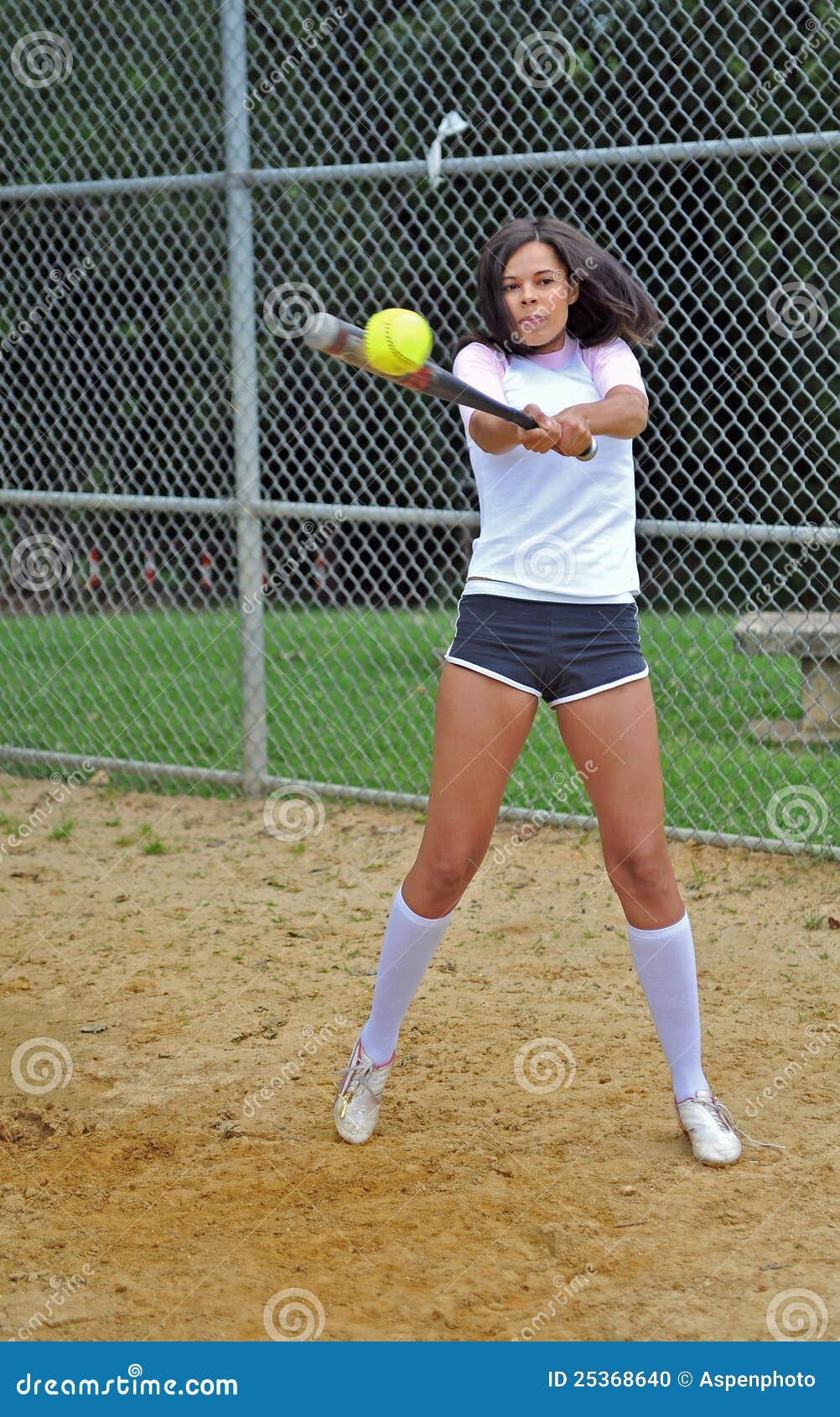 beautiful-biracial-young-female-softball-player-25368640.jpg