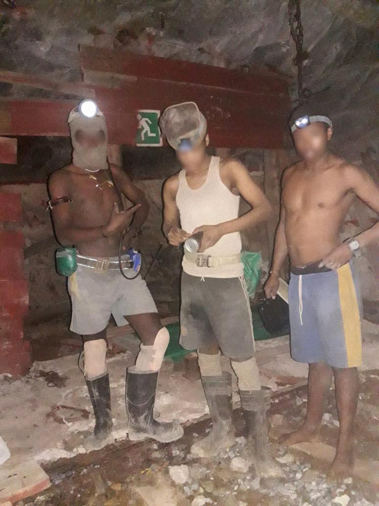 illegal-miners-with-flashlights.jpg