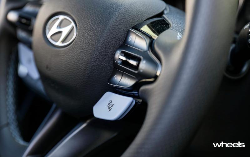 2021_Hyundai_i30_N_hatchback_polar_white_interior_steering_wheel_buttons.jpg