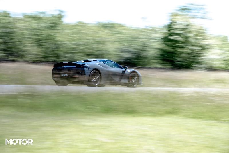 2021_Ferrari_SF90_Spider_Assetto_Fiorano_Grigio_Scuro_Australia_dynamic_rear_road_EDewar.jpg