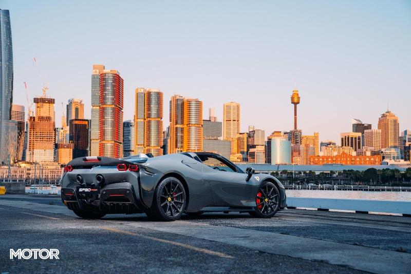 2021_Ferrari_SF90_Spider_Assetto_Fiorano_Grigio_Scuro_Australia_static_rear_city.jpg