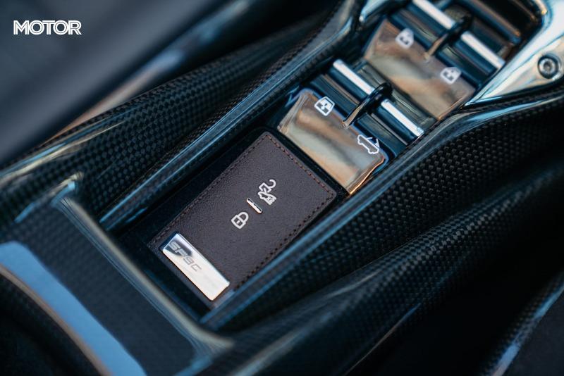 2021_Ferrari_SF90_Spider_Assetto_Fiorano_Grigio_Scuro_Australia_interior_keyfob_storage.jpg