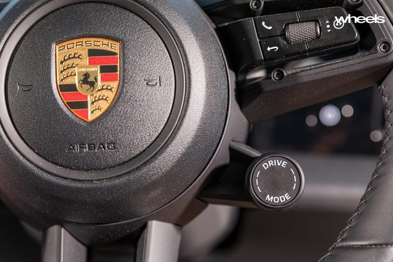 2022_Porsche_Taycan_4S_Cross_Turismo_Neptune_Blue_interior_steering_wheel_drive_mode_knob_Australia_MWilliams.jpg