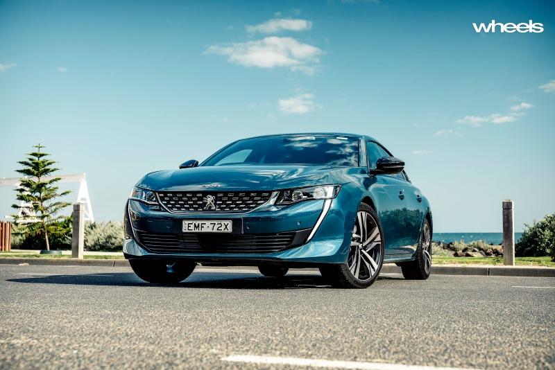 2021_Peugeot_508_GT_Fastback_Celebes_Blue_Australia_static_front_low_angle_EDewar.jpg