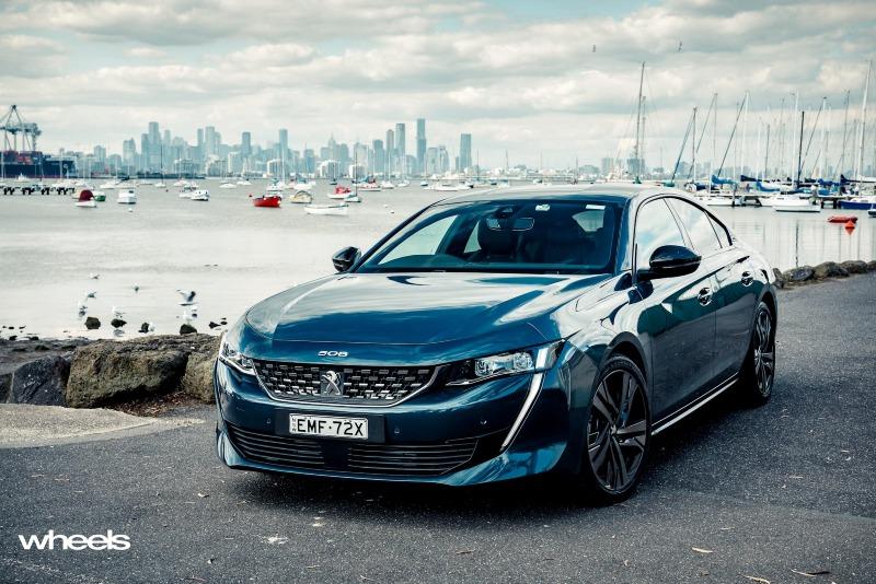 2021_Peugeot_508_GT_Fastback_Celebes_Blue_Australia_static_front_EDewar.jpg