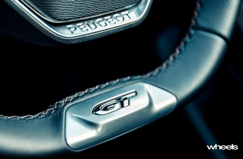 2021_Peugeot_508_GT_Fastback_Celebes_Blue_Australia_interior_steering_wheel_badge_EDewar.jpg