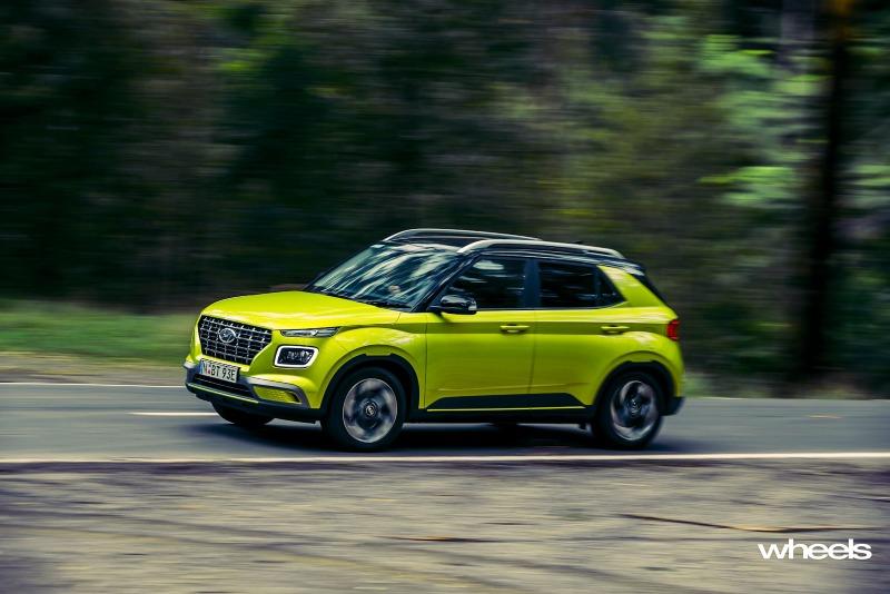 2020_Hyundai_Venue_Elite_Acid_Yellow_Australia_dynamic_panning_corner_front_2_ABrook.jpg