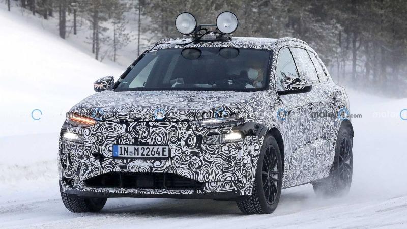 2023-audi-q6-e-tron-new-spy-shots-on-snow-wearing-production-headlights-and-taillights (1).jpg