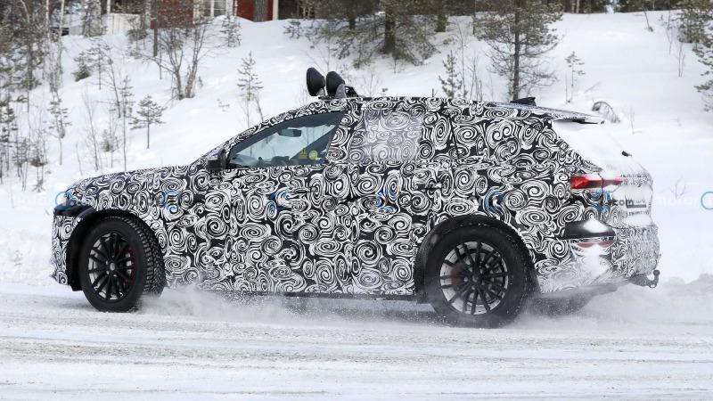 2023-audi-q6-e-tron-new-spy-shots-on-snow-wearing-production-headlights-and-taillights (6).jpg