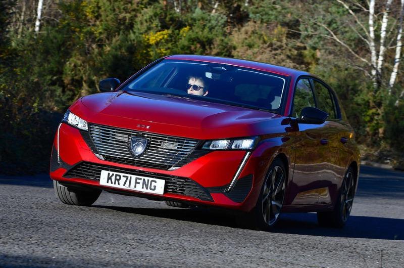 1-peugeot-308-puretech-130-gt-2022-uk-review-cornering-front.jpg