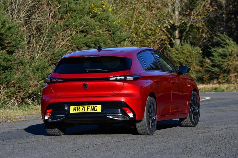 11-peugeot-308-puretech-130-gt-2022-uk-review-cornering-rear.jpg