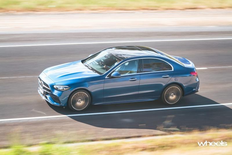2022_Mercedes-Benz_C300_Spectral_Blue_Metallic_Australia_dynamic_side_04.jpg