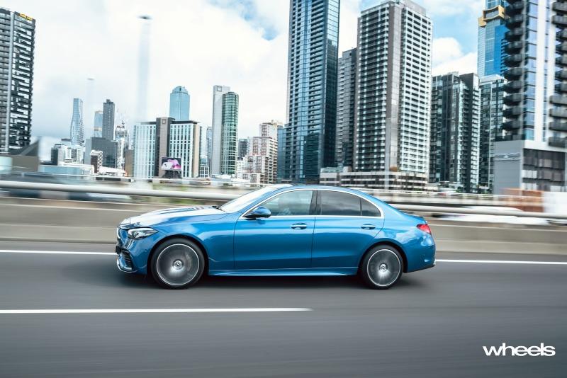 2022_Mercedes-Benz_C300_Spectral_Blue_Metallic_Australia_dynamic_side_09.jpg