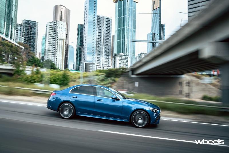2022_Mercedes-Benz_C300_Spectral_Blue_Metallic_Australia_dynamic_side_13.jpg