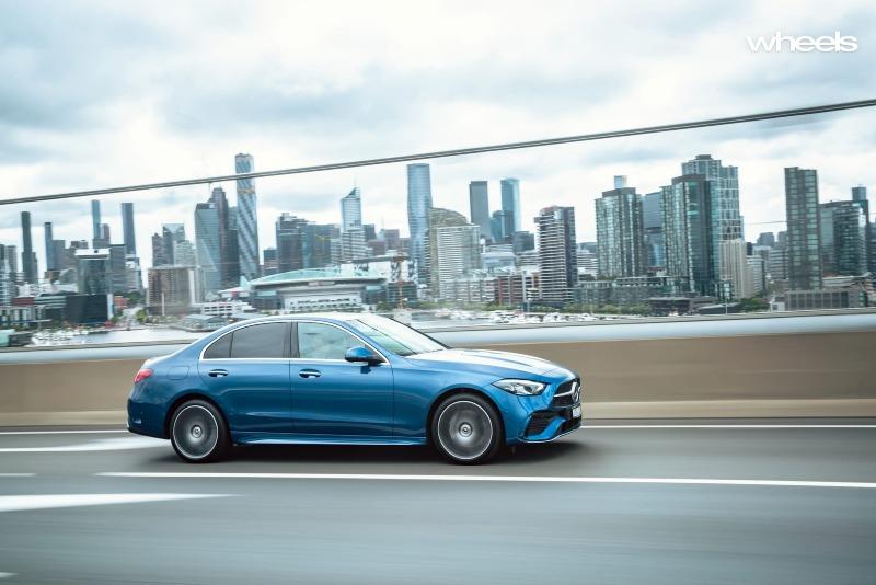 2022_Mercedes-Benz_C300_Spectral_Blue_Metallic_Australia_dynamic_front_32.jpg