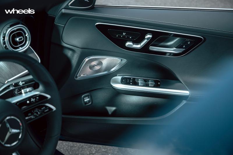2022_Mercedes-Benz_C300_Spectral_Blue_Metallic_Australia_interior_driver_door_panel_02.jpg