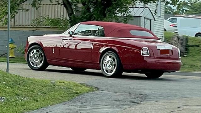 rolls-royce-phantom-drophead-coupe-in-a-seedy-part-of-town-v0-jnpq2gl9v3ya1.jpg
