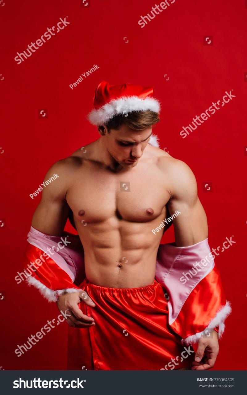 stock-photo-christmas-holidays-sexy-strong-santa-claus-wearing-hat-young-muscular-man-torso-six-pack-770964505.jpg