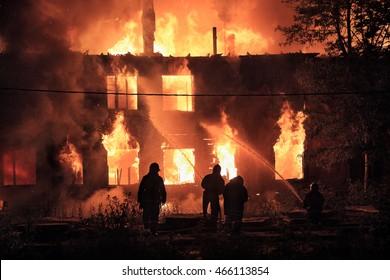 silhouettes-firefighters-on-burning-house-260nw-466113854.jpg